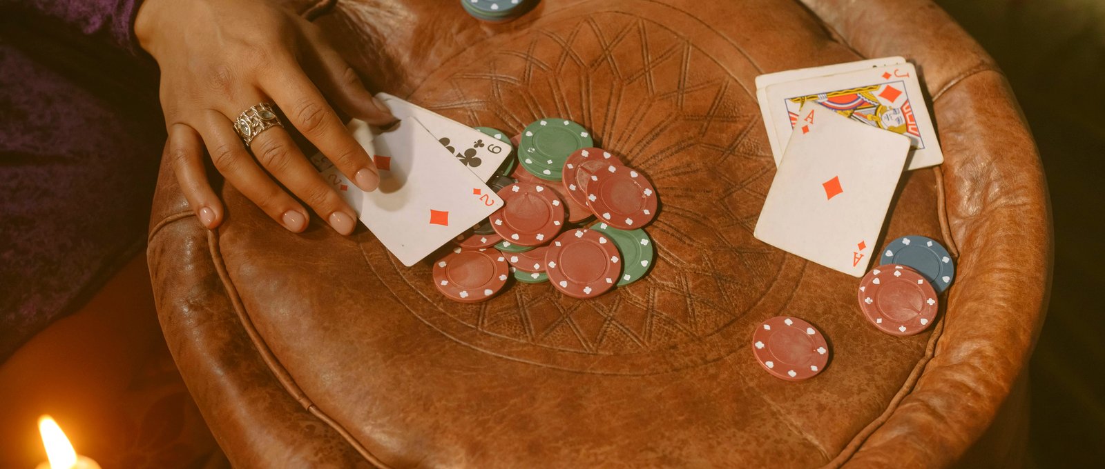 Warm-graded poker chips on a felt table